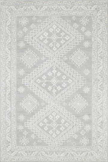 Close-up of the Paloma Area Rug. Hand-tufted wool rug in cream, light beige, and gray with a geometric diamond pattern. Design-Rectangle