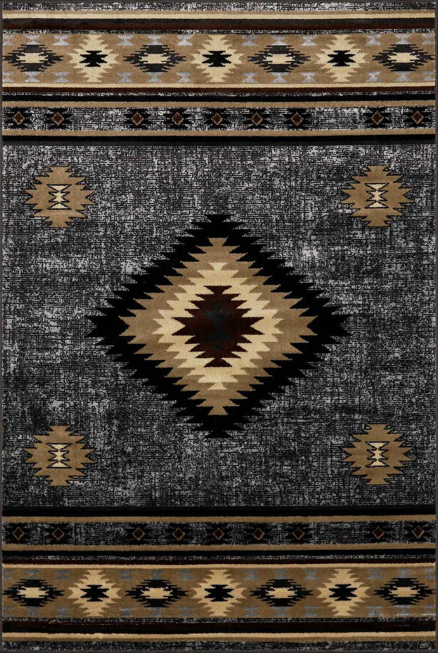 Close-up of the Buckhaven Area Rug. Southwestern design in black, charcoal, beige, and brown. Polypropylene, machine woven texture. Design-Rectangle