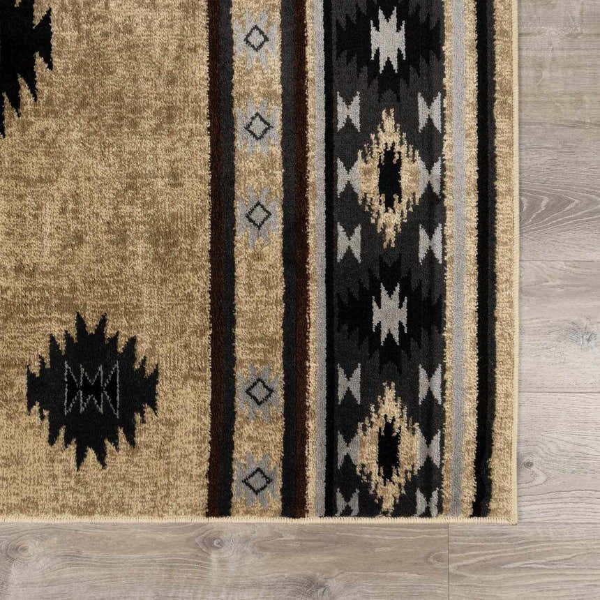 Close up of Buckhaven Brown Aztec Carpet showing the geometric pattern, and brown, black and beige colors. Swatch