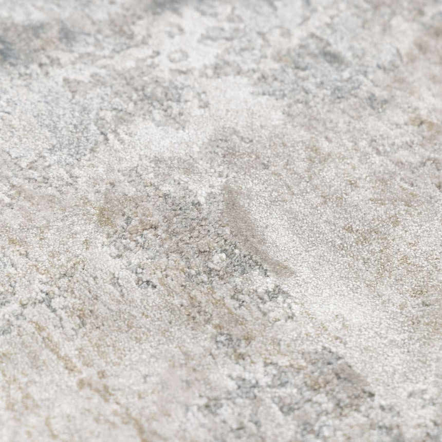 Close-up of Pialba Thick Luxe Abstract Smokey Rug. Soft texture with shades of white, gray, taupe, and sage. Texture