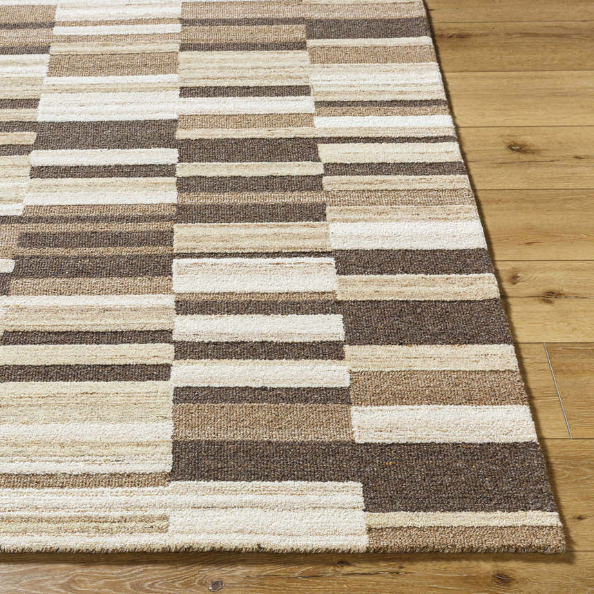 Close-up of the Amrita Beige Area Rug showing a geometric block pattern in beige, cream, brown, and tan wool. Front