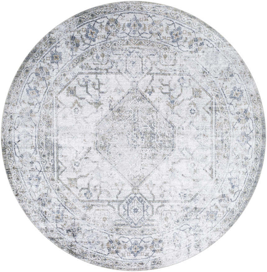Close-up of round Annlea Washable Area Rug. Farmhouse style rug in blue, sage, and white with traditional floral pattern. Design-Round-67