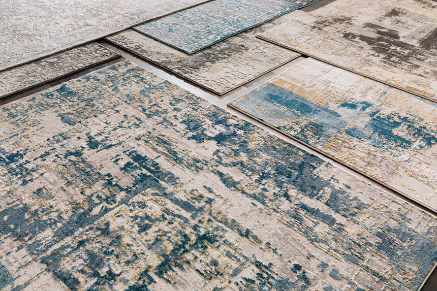 Close-up of Larne Area Rugs in dark blue, gray, light beige, tan, and white. Bohemian, contemporary, and vintage styles. Styleshot