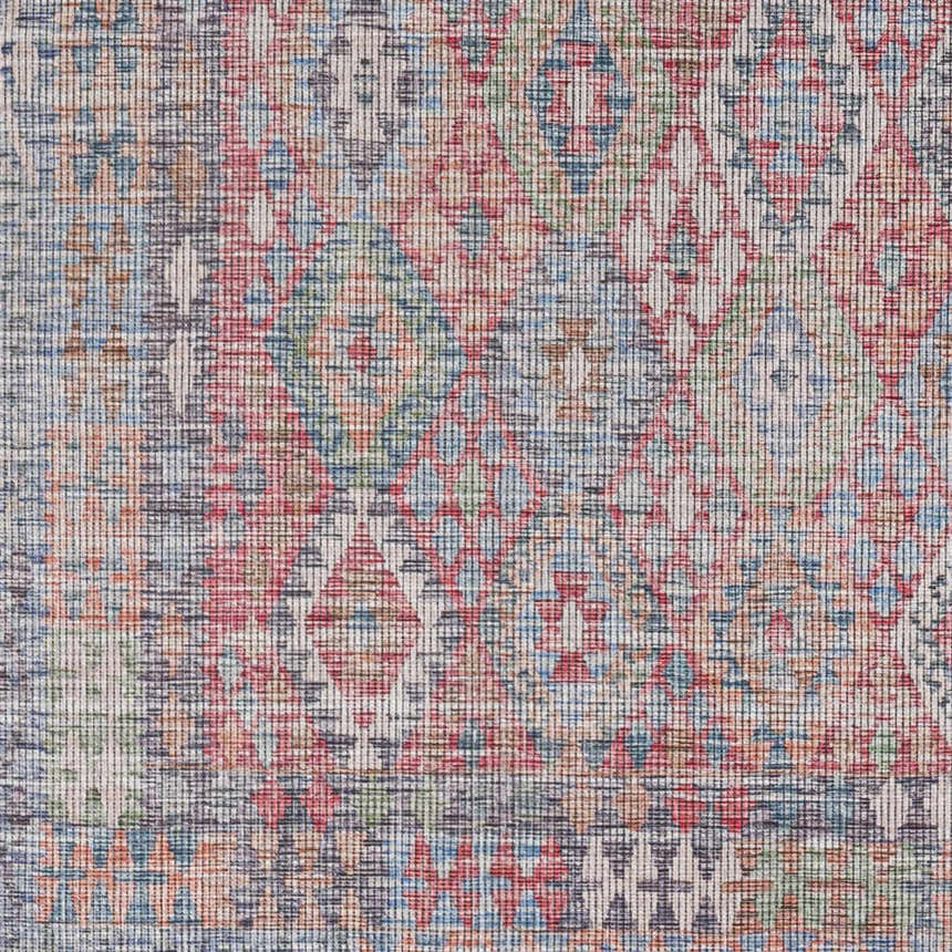 Close-up of the Ranao Washable Area Rug - Clearance, featuring a traditional diamond pattern in blue, red, green, and taupe. Swatch
