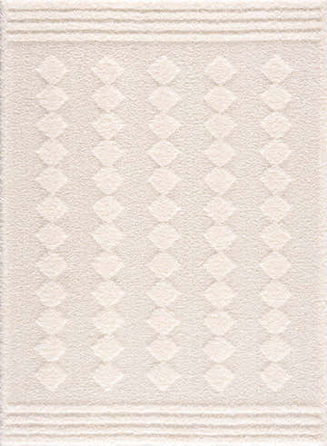Close-up of the Hija Cream High-Low Area Rug. Cream shag rug with subtle diamond pattern and textured high-low pile. Design-Rectangle-537