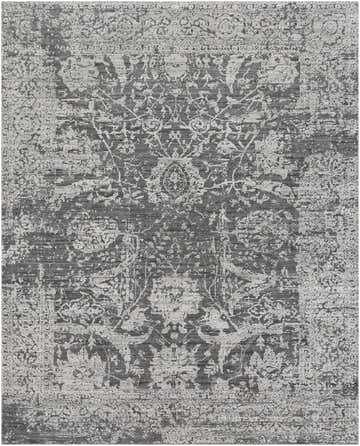 Close-up of the Riccall Area Rug, a hand-knotted rug in black, charcoal, and light slate with a traditional floral pattern. Design-Rectangle-810