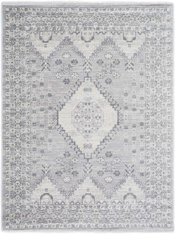 Close-up of the Aoibhe Area Rug. Machine-woven polyester rug in ivory, medium gray, and slate gray with a traditional floral pattern. Design-Rectangle-57