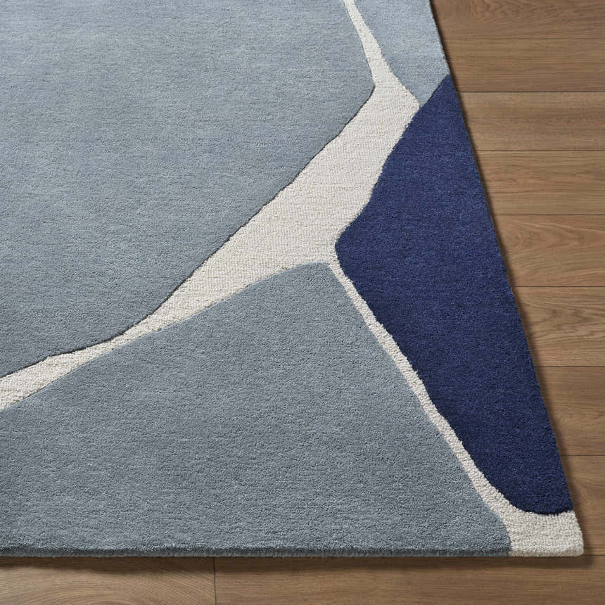Close up of the Robbins Modern Blue Wool Rug showing geometric design and wool texture. Front