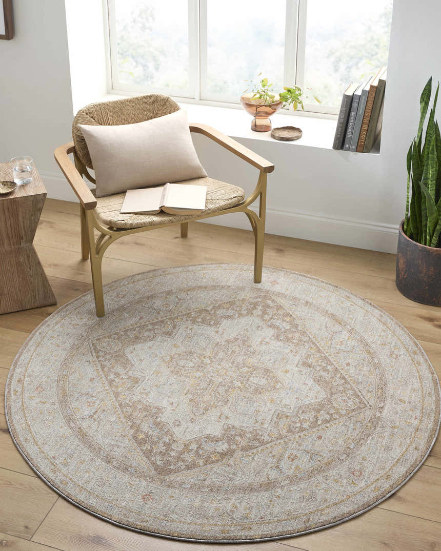 Cozy reading nook with round Roni Traditional rug in amber and taupe under a woven chair. Farmhouse style. Roomscene-Round