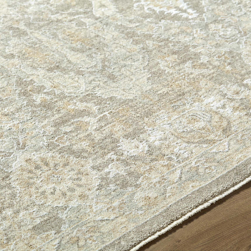 Close-up of the Almaas Medium Gray rug showing its traditional pattern, soft texture, and neutral color palette. Texture
