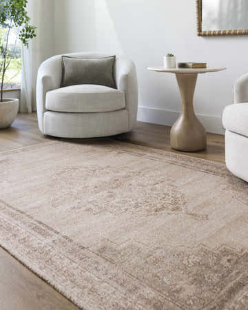 Living room scene with beige Luciana III Traditional Medallion Area Rug, white chairs, and light wood floors. Roomscene-Rectangle
