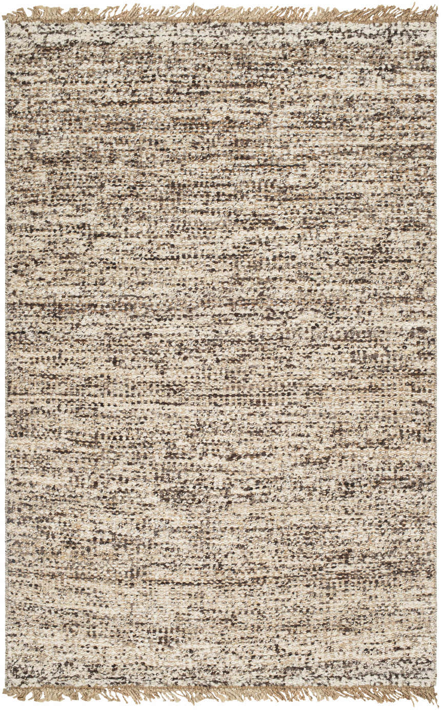 Close-up of the Tan Gopi Area Rug. Hand woven jute and wool rug in neutral tan, taupe, and black with fringe detail. Design-Rectangle-576