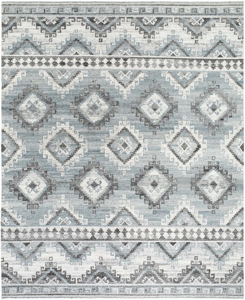 Close-up of Binda Area Rug. Geometric, Southwestern design in blue, gray, ivory, and brown. Hand-woven recycled PET yarn. Design-Rectangle-810