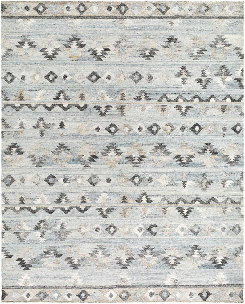 Close-up of the hand woven Denna Area Rug. Features a Southwestern pattern in black, blue, brown, and gray hues. Design-Rectangle-810