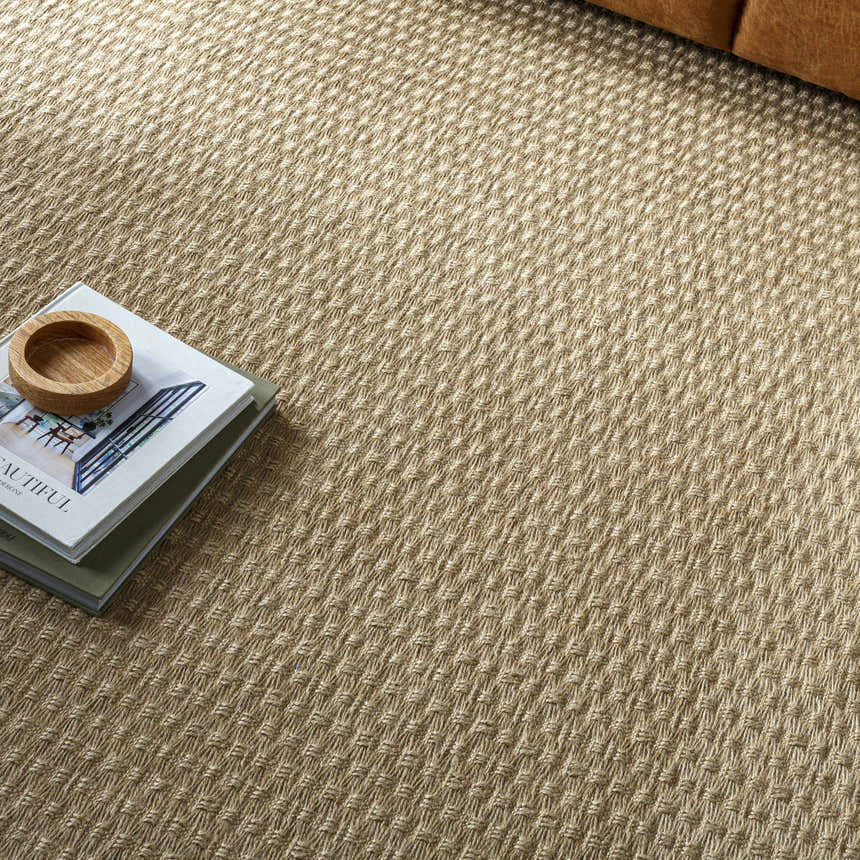 Close-up of the light brown Kimi Machine Woven Becki Owens x LIVABLISS rug showing texture and pattern. Styleshot