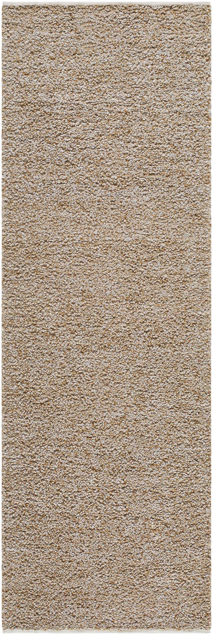 Close-up of the Kamil Beige Solid Area Rug showing its lambswool and light brown color and hand woven texture. Design-Runner-268