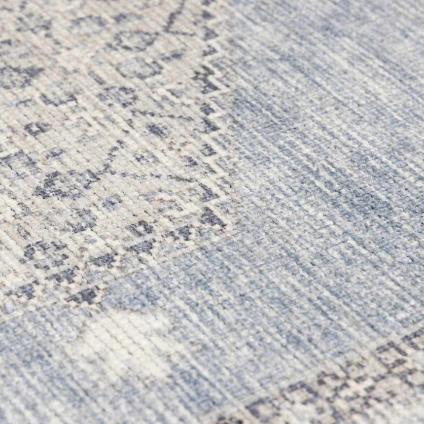 Close-up of the Lila Medallion Denim Area Rug showing its traditional medallion pattern and soft, textured weave. Texture