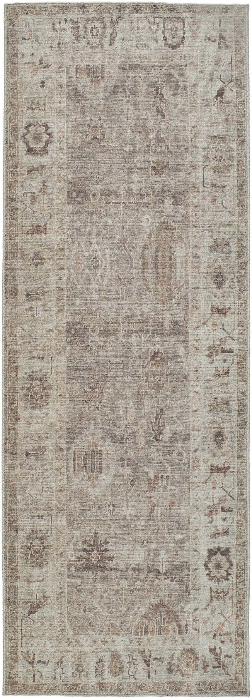 Close-up of the Matat Area Rug. Machine-woven polyester rug in beige, chestnut, ivory, tan, and taupe with a traditional pattern. Design-Runner-2773