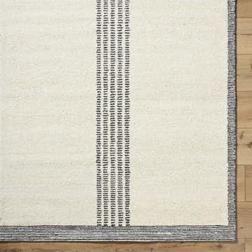 Close up of the hand tufted Ande Ivory Area Rug showing its wool texture and light silver stripes. Swatch
