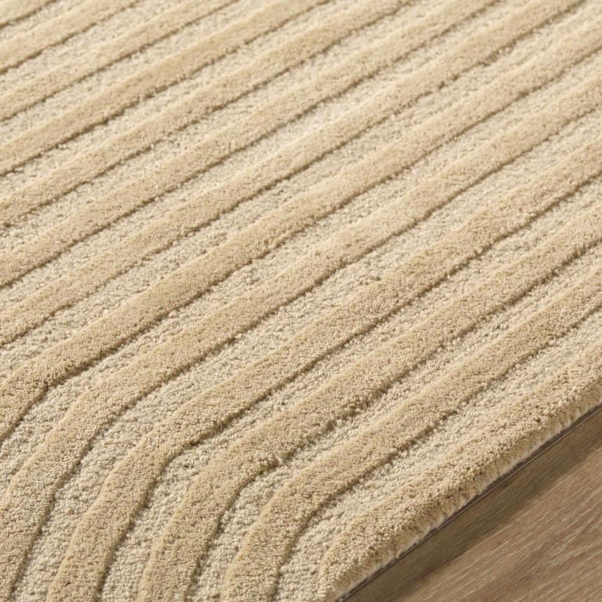 Close-up of the hand-tufted Whan Beige Area Rug, showing its textured, contemporary striped design and 100% wool material. Texture