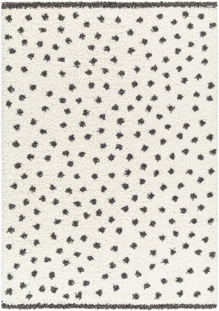 Close up of Chaia Dotted Black & White Plush Rug. Shag rug with black dots on a white background. Contemporary style. Design-Rectangle-537