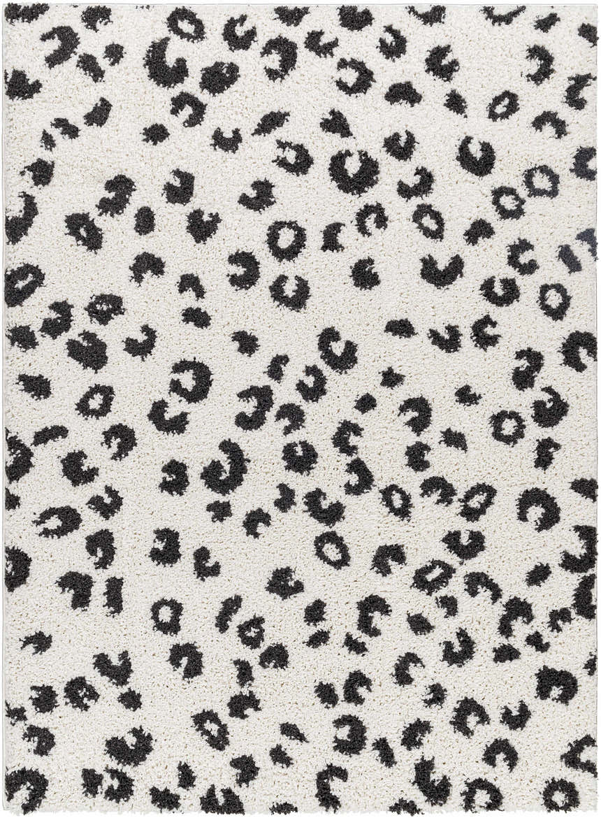 Close-up of the Zhen Black Spots Leopard Rug, a shag rug with a black leopard print design on a white background. Design-Rectangle-537