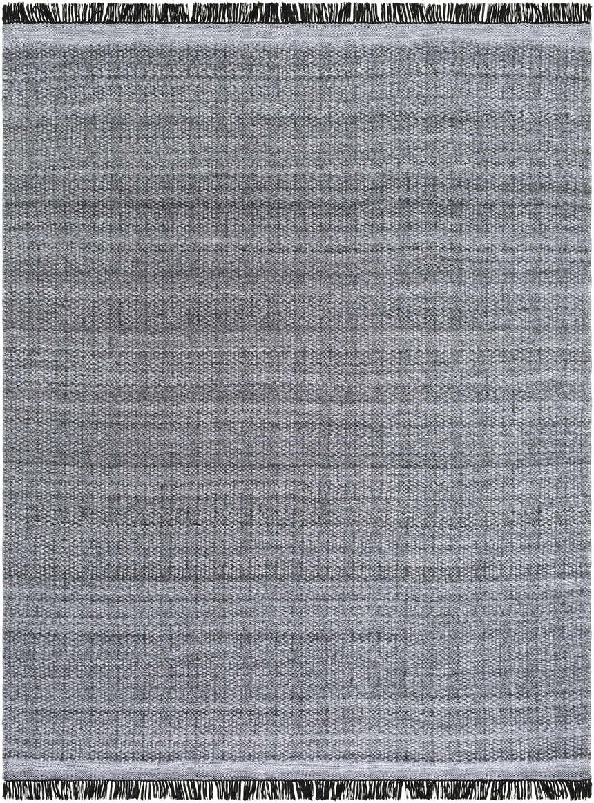 Close-up of the hand woven Dark Gray Anane Area Rug, featuring a subtle pattern and black fringe. Design-Rectangle-810