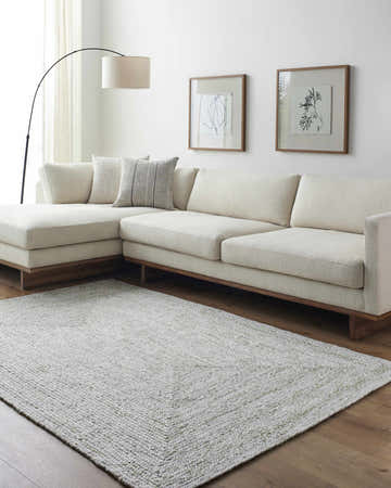 Living room scene with a cream sectional sofa and Kenyi Lime Green Area Rug on hardwood floors. Roomscene-Rectangle