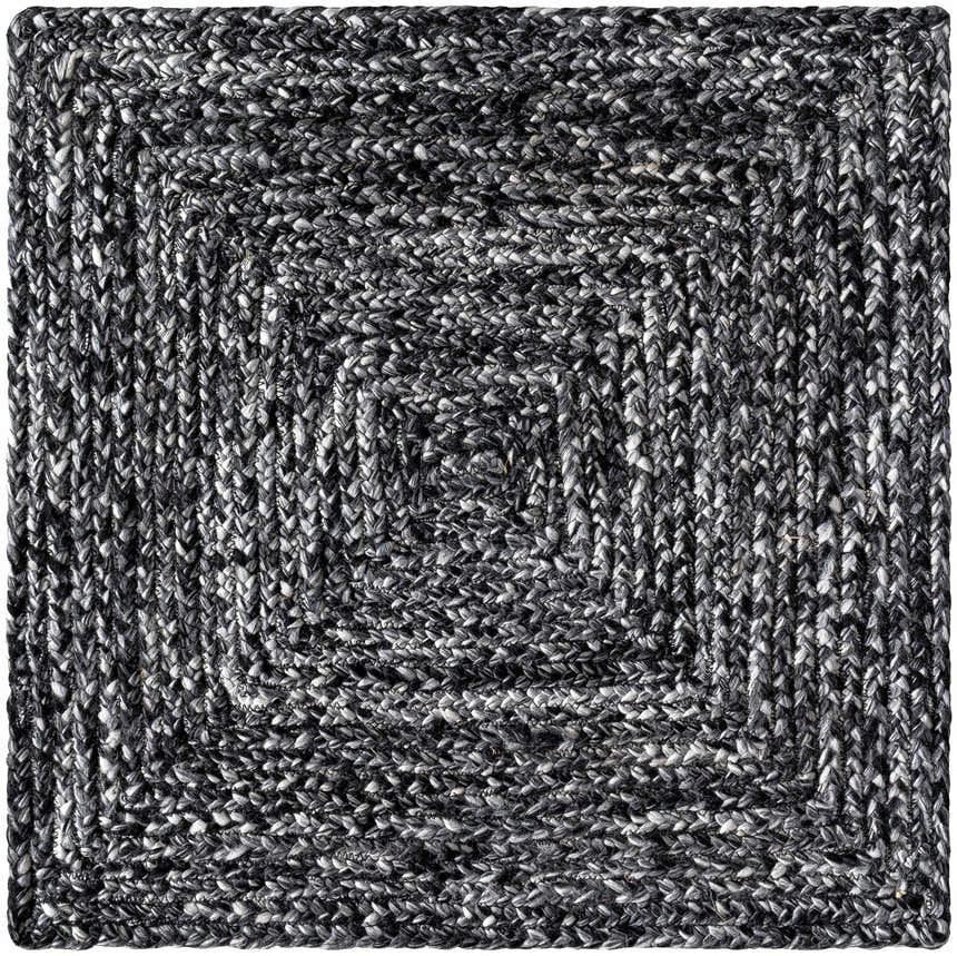 Close-up of the hand woven Kenyi Black Area Rug. Features a contemporary black and white concentric square design. Texture