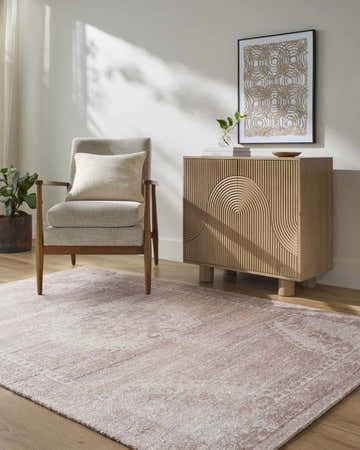 Entryway with blush Alafin Area Rug, light wood cabinet, and gray chair creating a warm, neutral farmhouse style. Roomscene-Rectangle