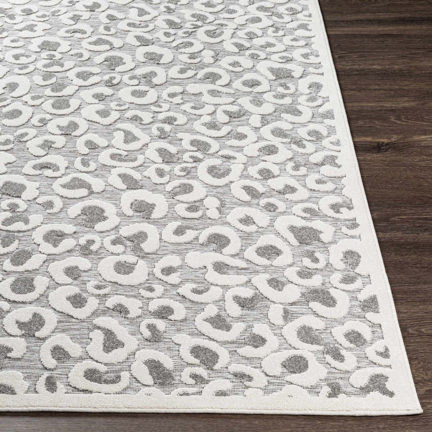 Close-up of Seascale Outdoor Carpet. Gray leopard print on a textured white background. Contemporary animal style. Front