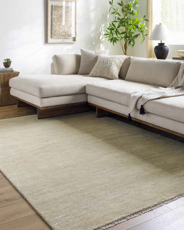 Living room scene with a Powa Light Yellow Area Rug, beige sectional sofa, and wood floors. Roomscene-Rectangle