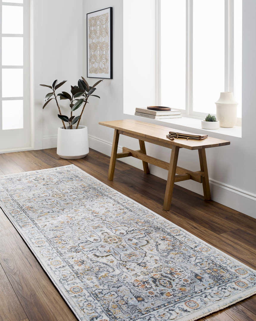 Hallway scene with a Hewez Area Rug in cloud gray and brown, bench, plant, and bright light. Roomscene-Runner