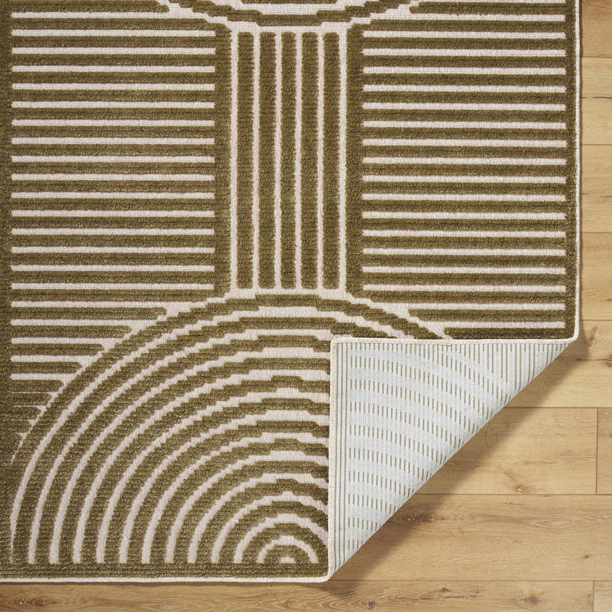 Close-up of the Deron Khaki Washable Area Rug showing its olive and white geometric pattern and machine-woven texture. Fold