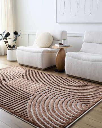 Living room scene with the Deron Brown Washable Area Rug, white chairs, wood side table, and plant. Contemporary style. Roomscene-Rectangle