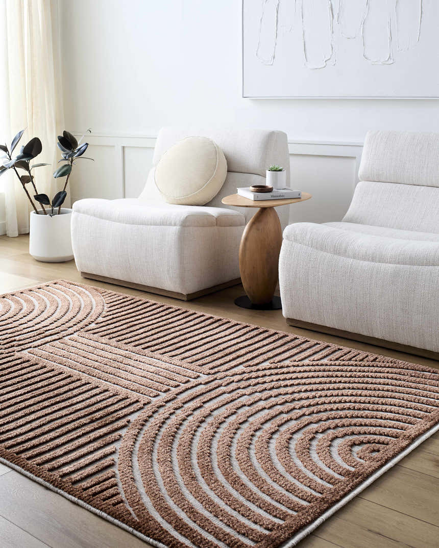 Living room scene with the Deron Brown Washable Area Rug, white chairs, wood side table, and plant. Contemporary style. Roomscene-Rectangle
