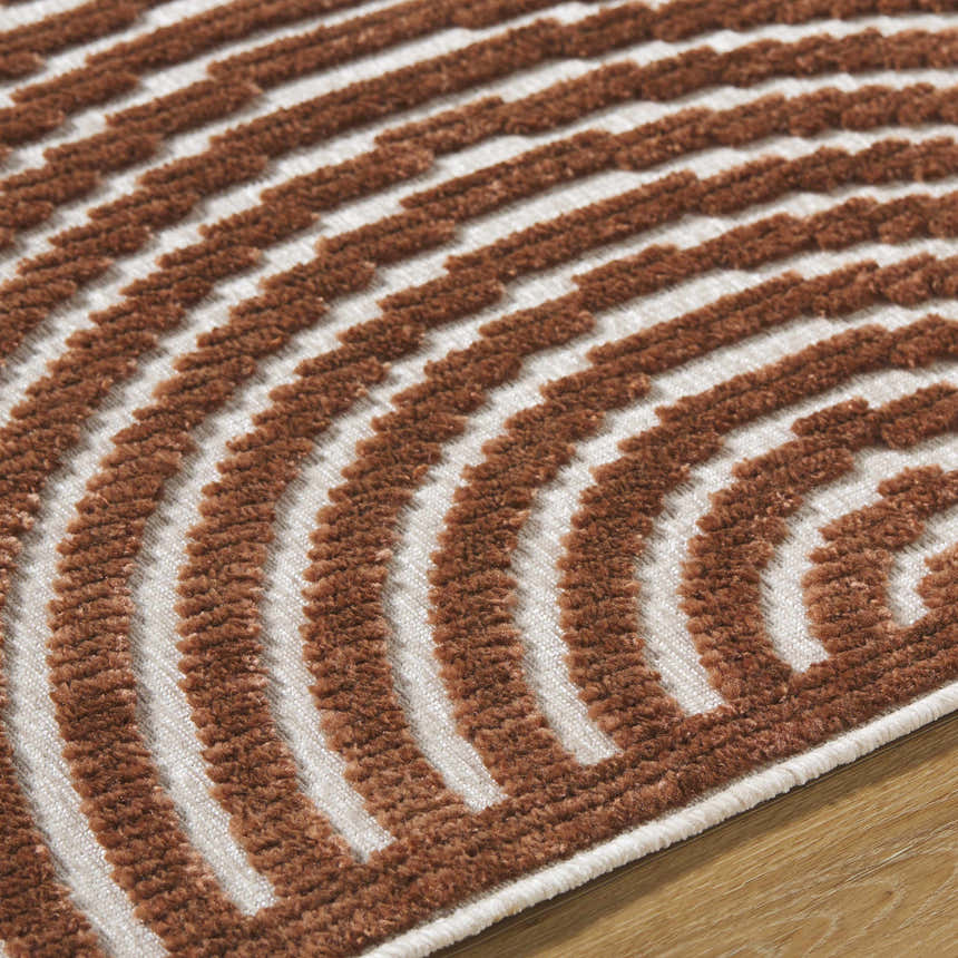 Close-up of the Deron Brown Washable Area Rug, featuring a contemporary brown and white striped pattern. Texture