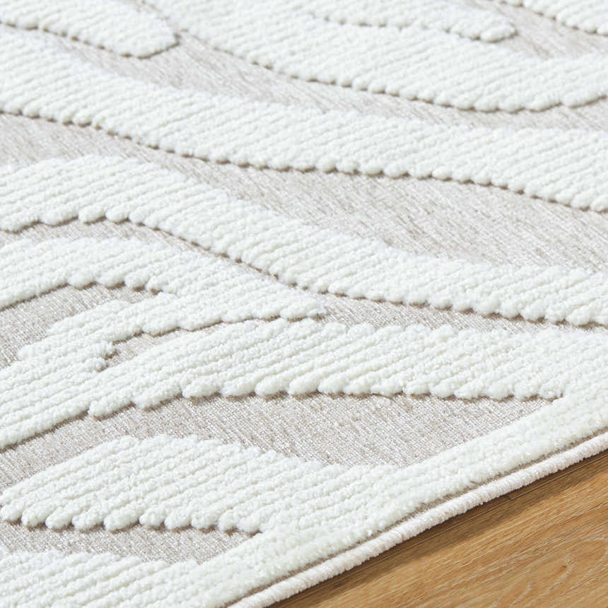 Close-up of the Keto Off-White 3D Washable Area Rug, showing the textured off-white pattern on a light gray background. Texture