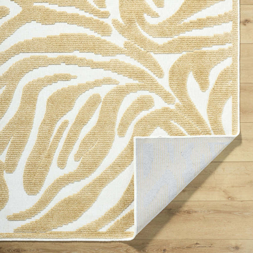 Close-up of Keto White Washable Area Rug. Mustard, white contemporary rug with a textured, abstract pattern. Machine woven. Fold