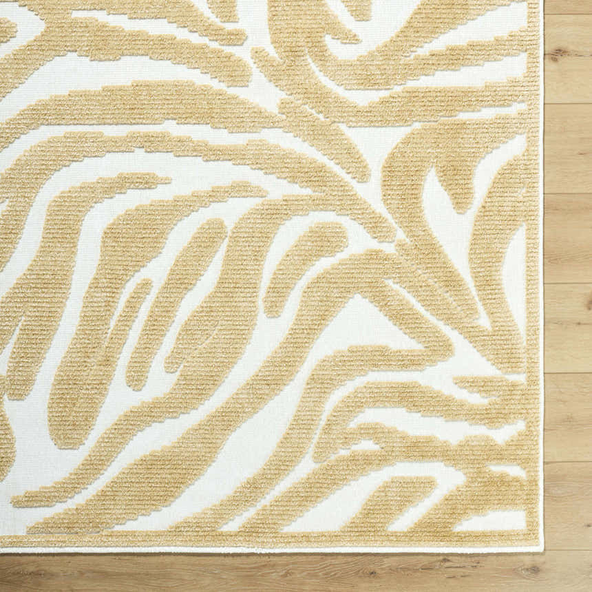 Close-up of the Keto White Washable Area Rug featuring a mustard abstract pattern on a white background. Corner
