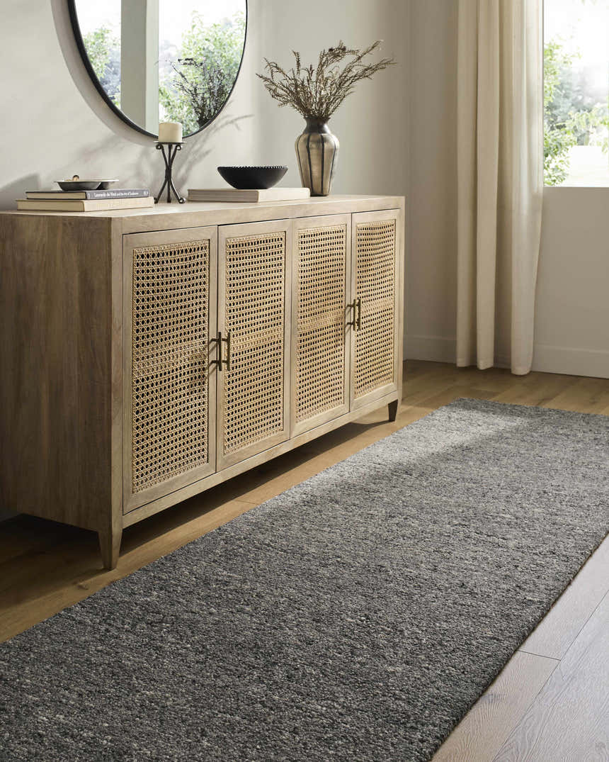 Entryway with a light wood console table and a Sevan Charcoal Wool Area Rug runner. Roomscene-Runner