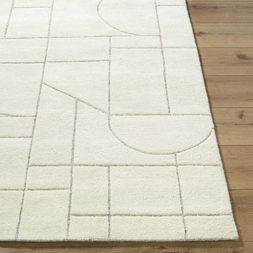 Close up of the Fusao Off White Area Rug showing its geometric pattern and wool texture. Front