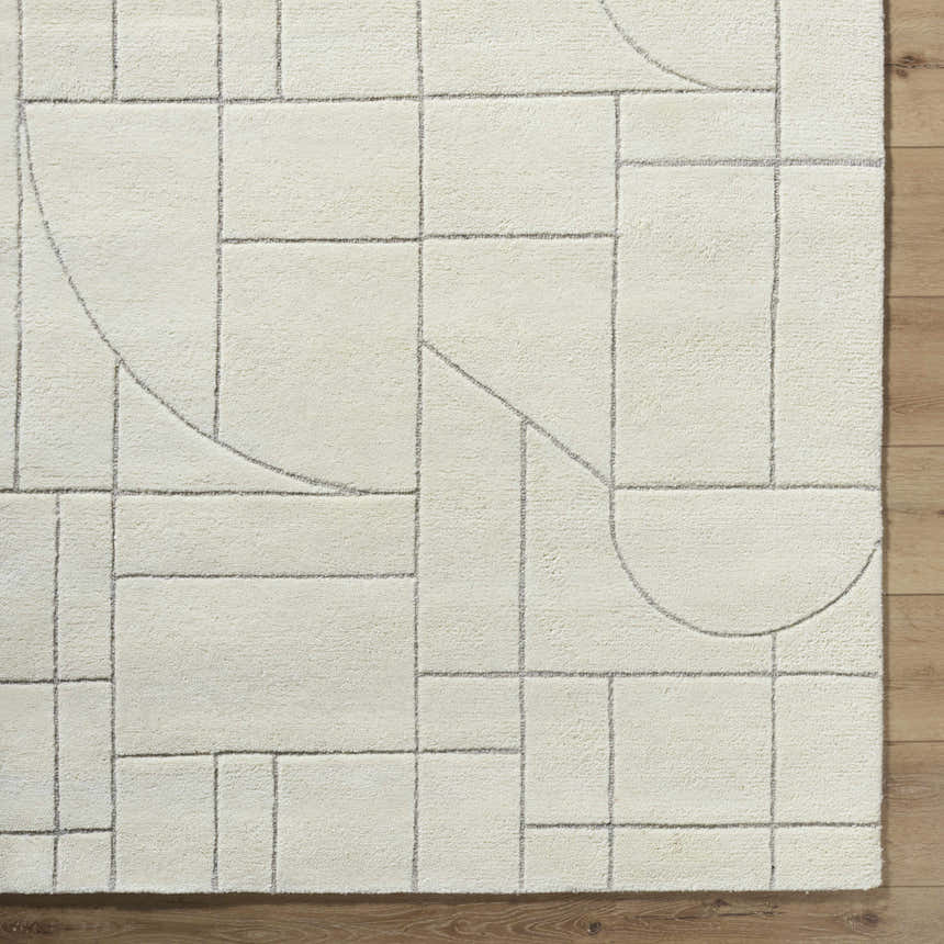 Close up of the Fusao Off White Area Rug. Wool rug with geometric light silver line pattern. Swatch