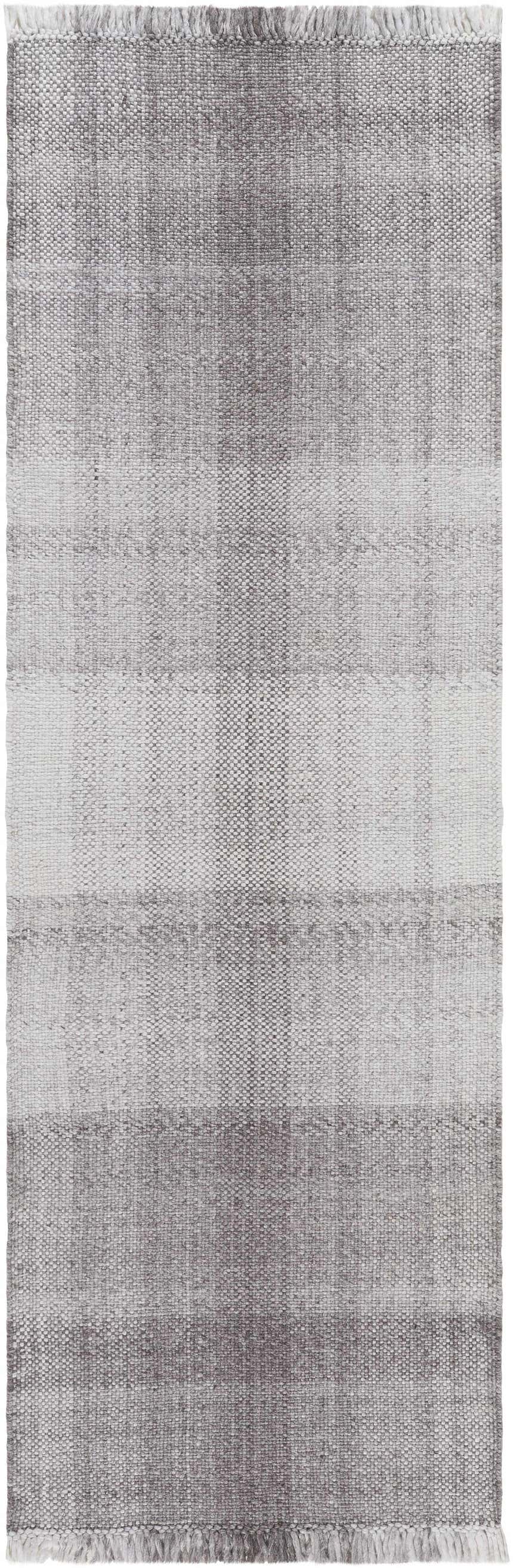 Close-up of the hand woven Fiora Area Rug. Features a gray, light gray, and medium gray striped pattern with fringe. Design-Runner-268
