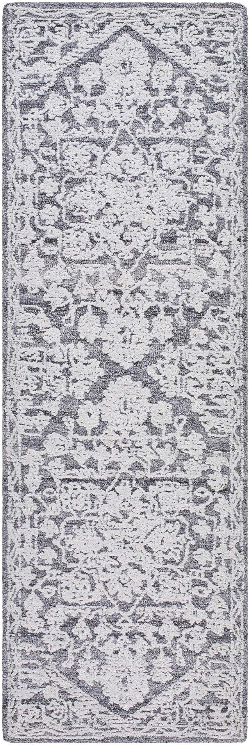 Close-up of the Blue Derya Area Rug. Hand-tufted rug with traditional gray and arctic stone floral pattern. Design-Runner-268