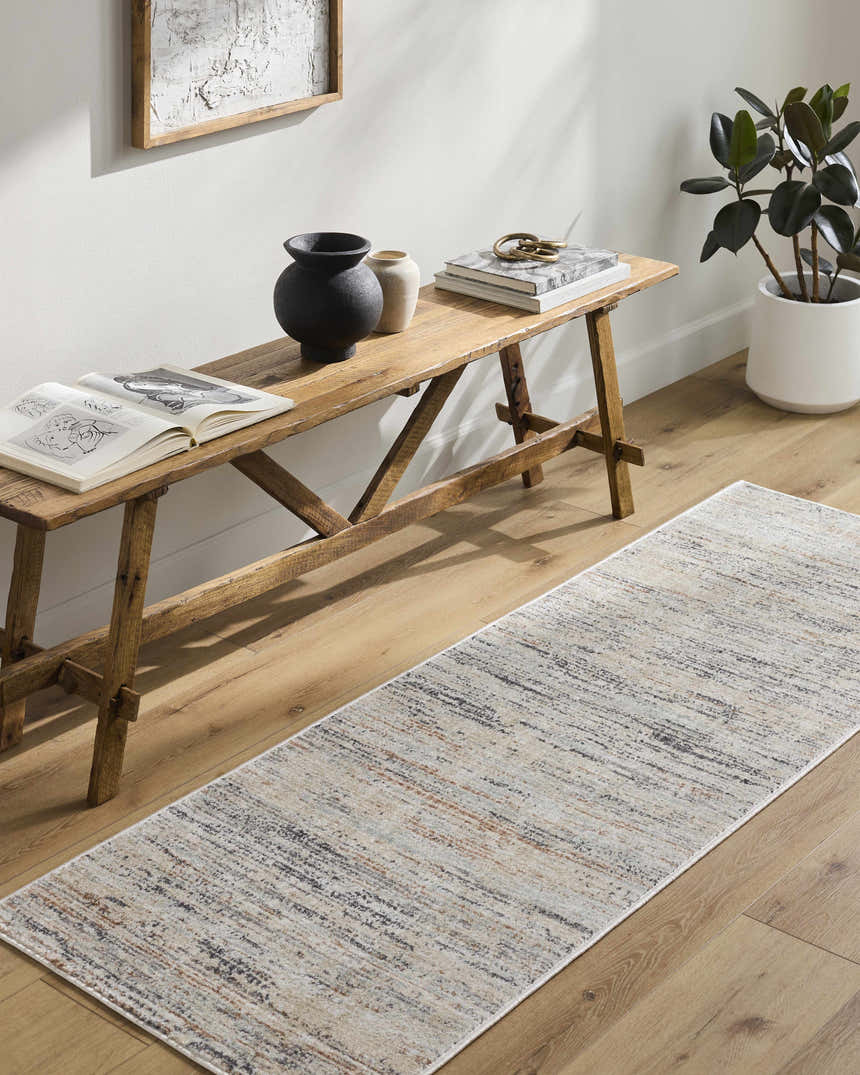 Hallway with wood bench and Fizza Area Rug runner in beige, bone, and gray tones on wood floor. Roomscene-Runner