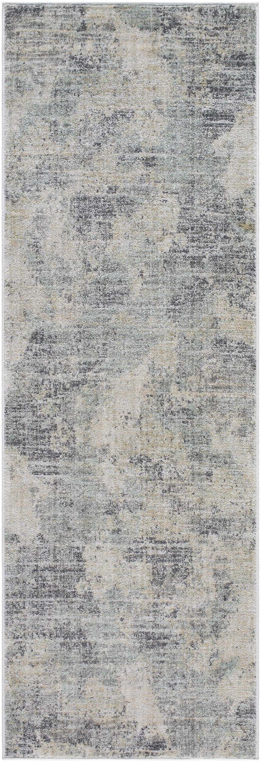 Close-up of the Gatik Area Rug showing a distressed, contemporary pattern in beige, gray, and taupe hues. Design-Runner