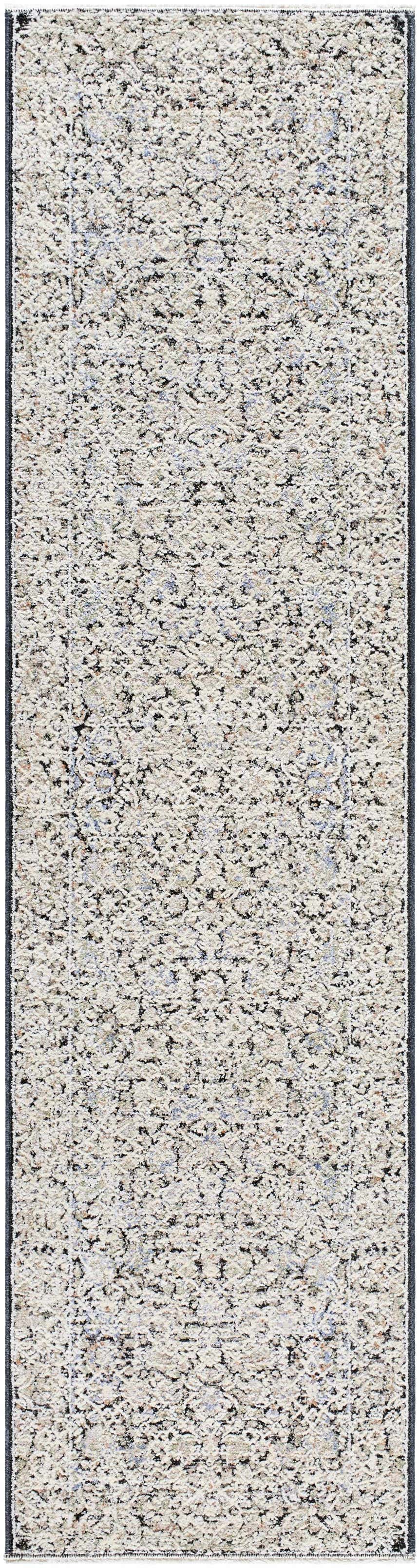 Close-up of the Haran Cloud Gray Area Rug, a machine-woven rug with a farmhouse style pattern in cloud gray and medium gray. Design-Runner-2710