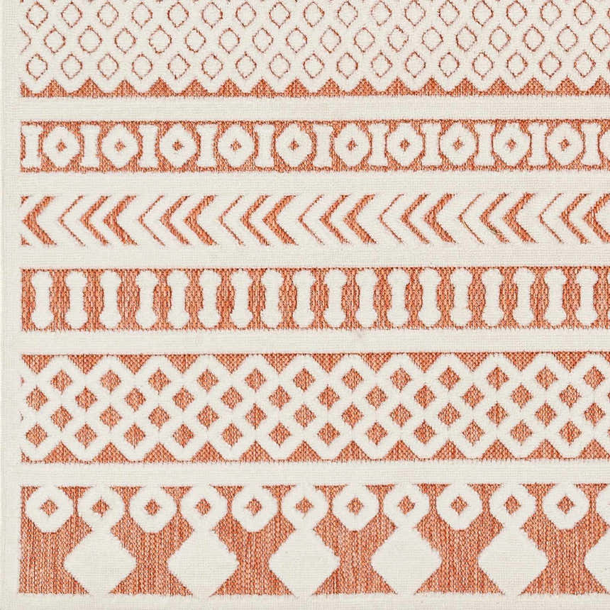 Close-up of the Jove Orange Outdoor Rug, featuring a bone and terracotta Southwestern geometric pattern. Swatch