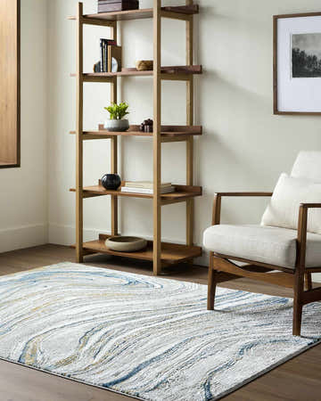 Living room scene with a Gregg Silver Gray Marble Area Rug, wood shelving, and mid-century modern chair. Roomscene-Rectangle